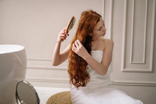Woman Brushing Her Red Hair