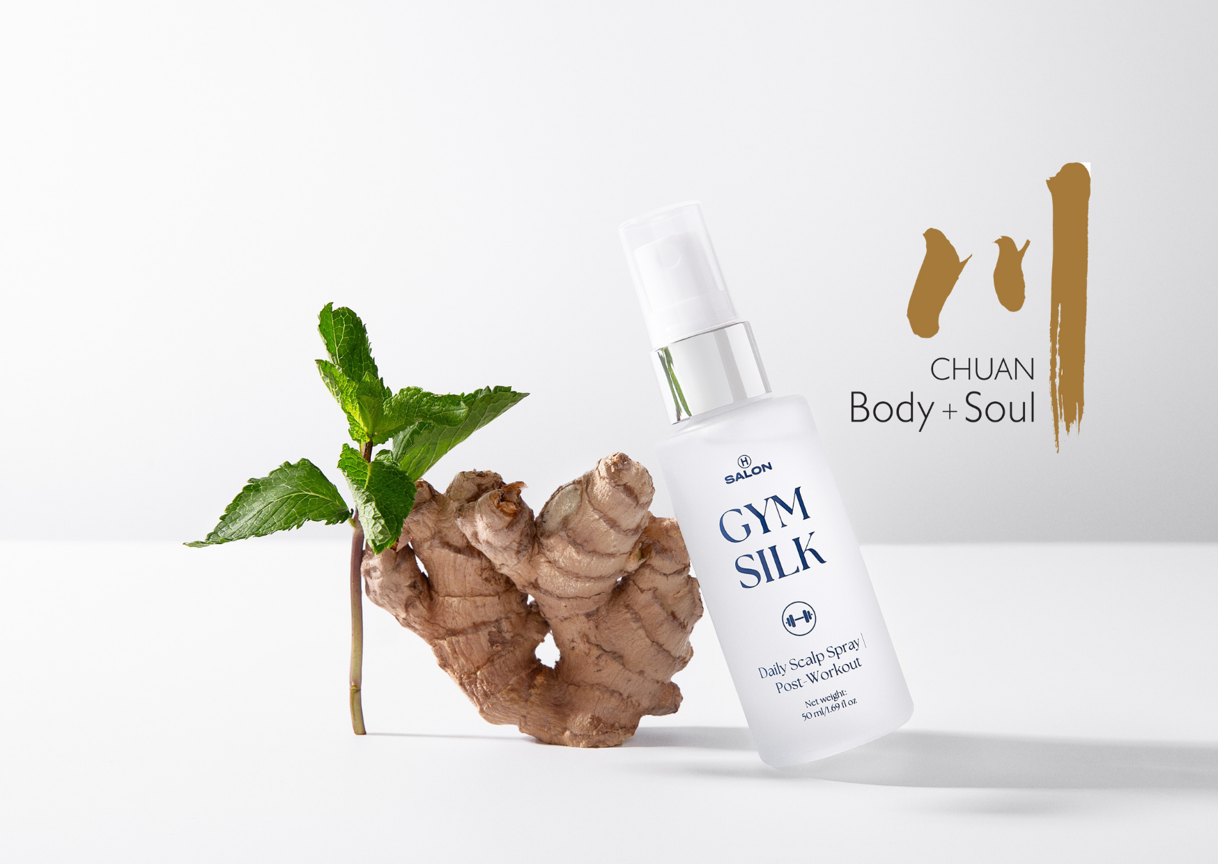 Gym Silk product with ginger root and mint leaves on a white background