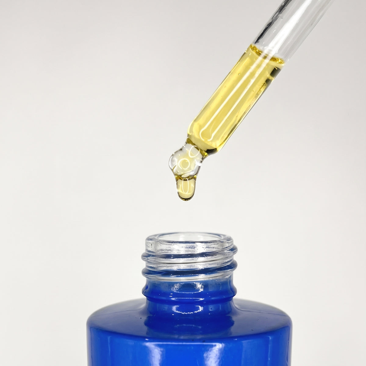 Close-up of the botanical oil texture of H Salon Ground Recovery Oil®