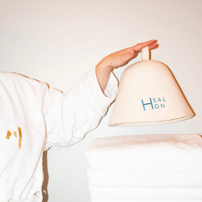 H Salon merino wool sauna hat worn during a sauna session